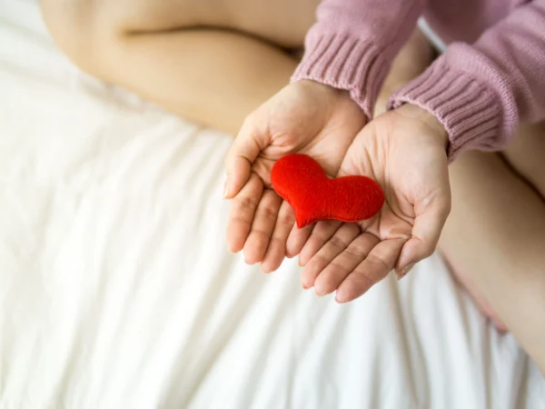 two hands holding a heart